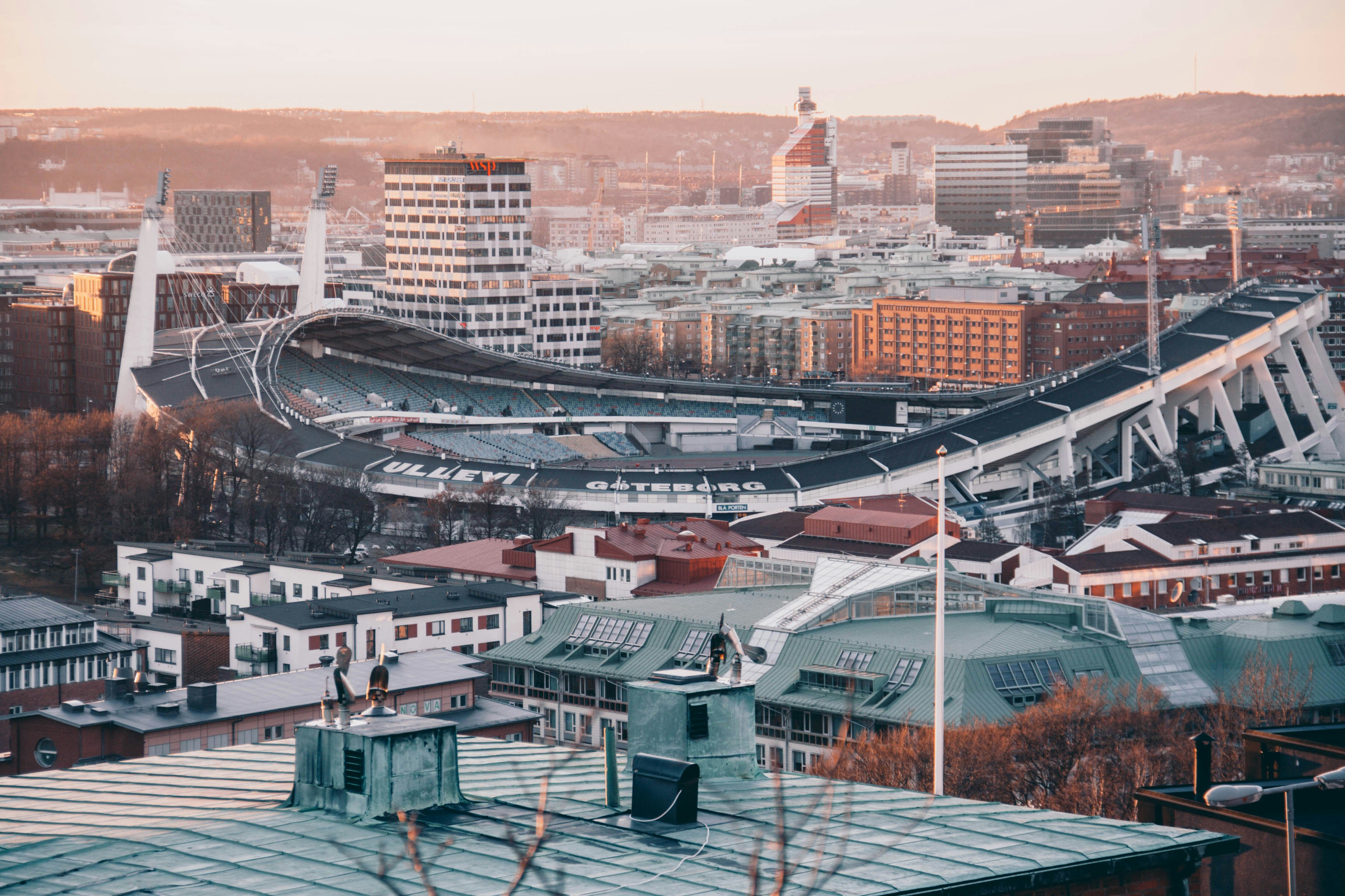 Medical scrubs and stethoscope with a Gothenburg harbor and skyline view